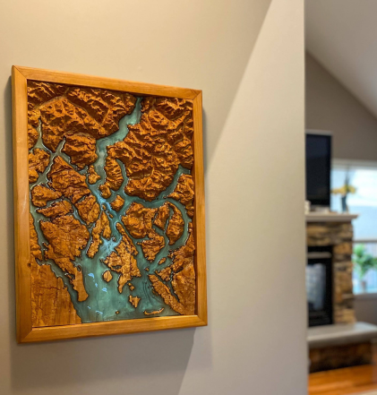 Wooden Desolation Sound Map hanging up in a room